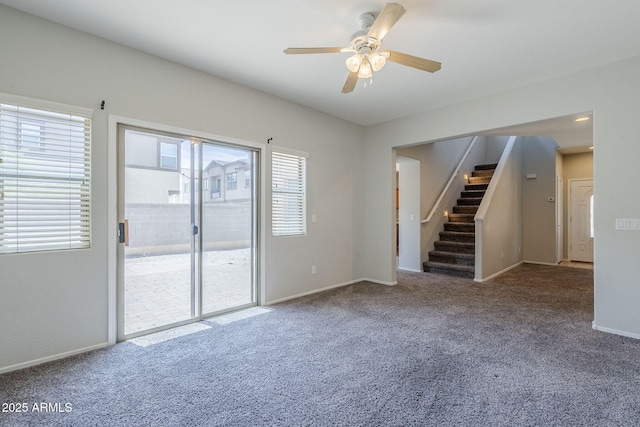 14881 W Ashland Ave, Goodyear, AZ 85395 - empty room featuring carpet, ceiling fan, stairs, and baseboards