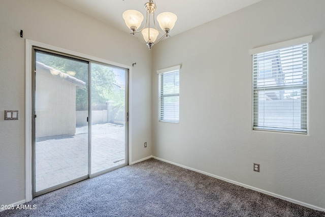 14881 W Ashland Ave, Goodyear, AZ 85395 - unfurnished room with a chandelier, carpet, and baseboards