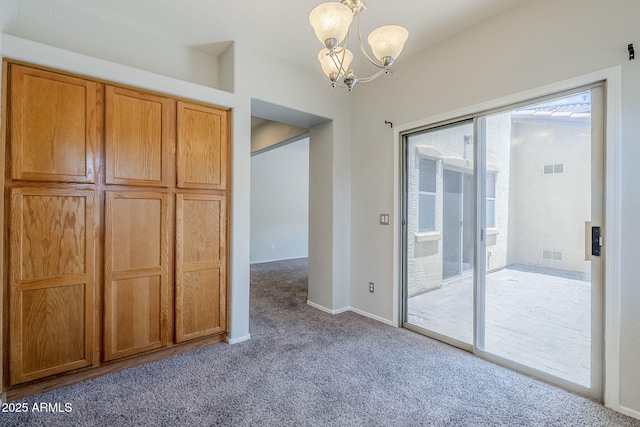 14881 W Ashland Ave, Goodyear, AZ 85395 - unfurnished dining area with carpet flooring, a chandelier, plenty of natural light, and baseboards