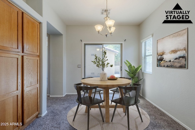 14881 W Ashland Ave, Goodyear, AZ 85395 - dining area featuring carpet, a chandelier, and baseboards