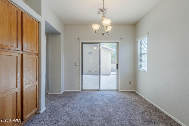 14881 W Ashland Ave, Goodyear, AZ 85395 - carpeted spare room with a chandelier and baseboards