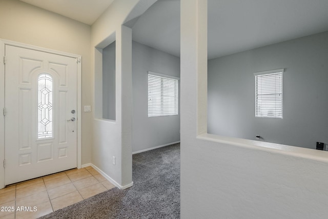 14881 W Ashland Ave, Goodyear, AZ 85395 - entrance foyer featuring carpet floors, tile patterned flooring, and baseboards