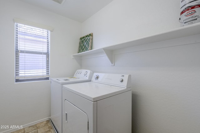 14881 W Ashland Ave, Goodyear, AZ 85395 - washroom with washing machine and clothes dryer, healthy amount of natural light, and baseboards