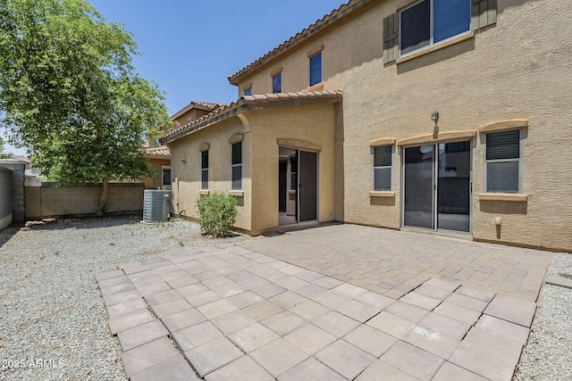 14881 W Ashland Ave, Goodyear, AZ 85395 - back of property featuring central AC unit, stucco siding, a patio, and a tiled roof