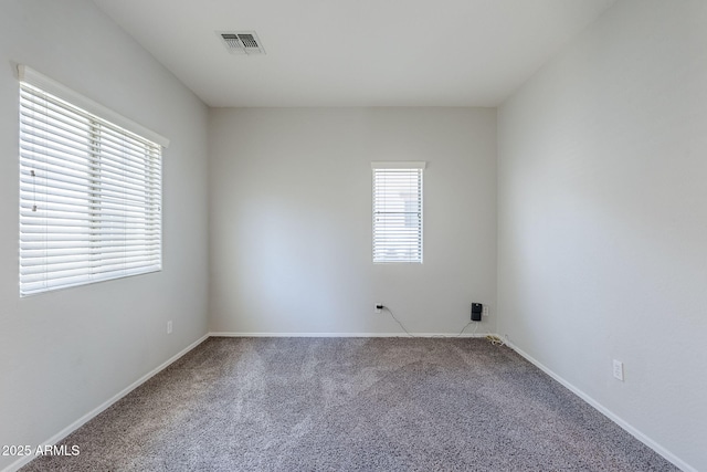14881 W Ashland Ave, Goodyear, AZ 85395 - carpeted spare room featuring baseboards