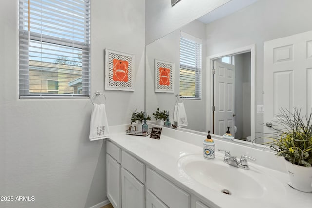 bathroom with toilet and vanity