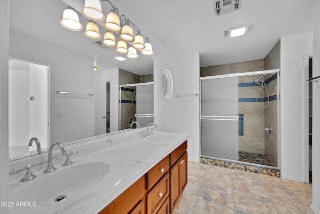 bathroom with walk in shower and vanity