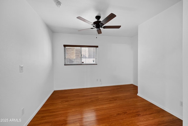 unfurnished room with hardwood / wood-style flooring and ceiling fan