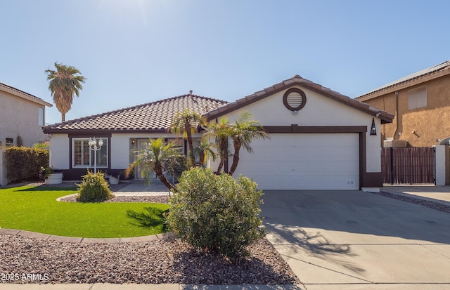 view of front facade with a front lawn and a garage