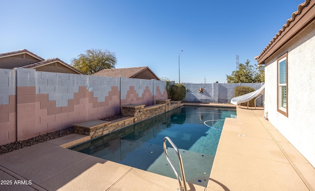 view of pool with a water slide