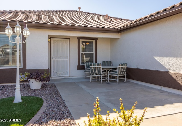 doorway to property with a patio