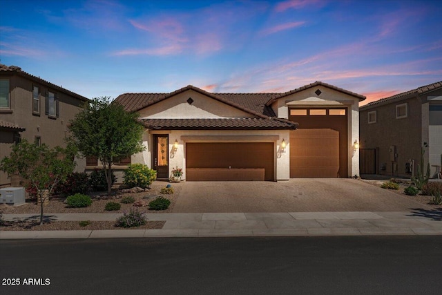 22912 E Domingo Rd, Queen Creek, AZ 85142 - mediterranean / spanish house with stucco siding, a tiled roof, driveway, and a garage