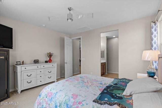 22912 E Domingo Rd, Queen Creek, AZ 85142 - bedroom featuring light carpet, ensuite bathroom, and baseboards