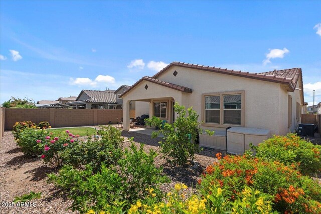 22912 E Domingo Rd, Queen Creek, AZ 85142 - back of property featuring a fenced backyard, a tile roof, a patio area, and stucco siding