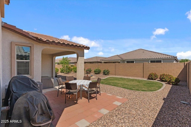 22912 E Domingo Rd, Queen Creek, AZ 85142 - view of patio / terrace featuring a fenced backyard, outdoor dining space, and a grill