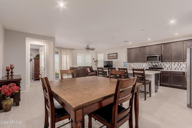 dining room featuring ceiling fan