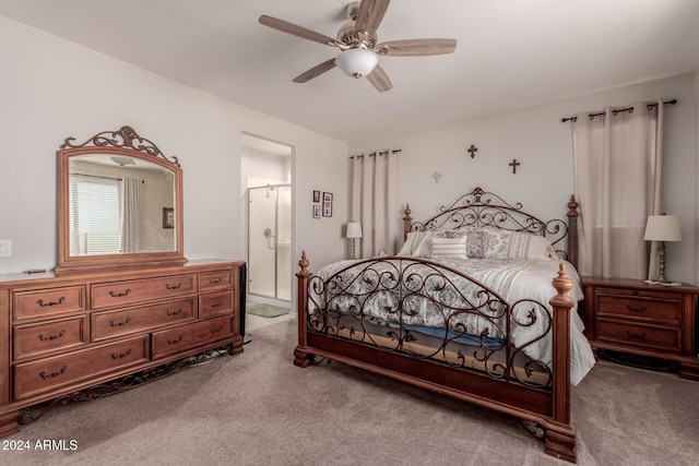 bedroom with carpet flooring, ensuite bath, and ceiling fan