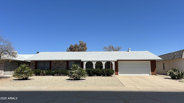 19417 N Palo Verde Dr, Sun City, AZ 85373 - ranch-style home with driveway, an attached garage, and brick siding