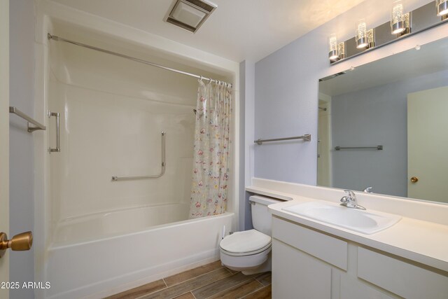 19417 N Palo Verde Dr, Sun City, AZ 85373 - bathroom with toilet, vanity, wood finish floors, shower / bath combo with shower curtain, and visible vents