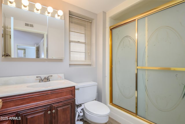 19417 N Palo Verde Dr, Sun City, AZ 85373 - bathroom with toilet, vanity, visible vents, and a shower stall