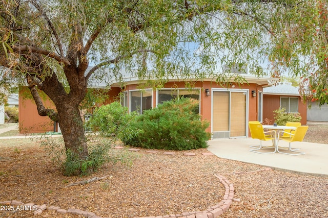 19417 N Palo Verde Dr, Sun City, AZ 85373 - back of house featuring stucco siding and a patio
