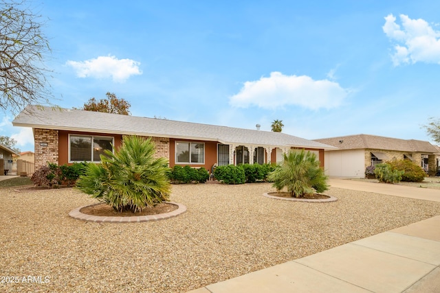 19417 N Palo Verde Dr, Sun City, AZ 85373 - ranch-style home with brick siding and concrete driveway