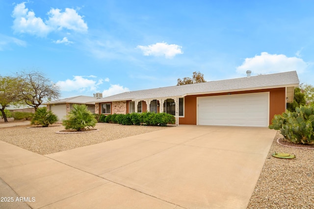 19417 N Palo Verde Dr, Sun City, AZ 85373 - ranch-style home with concrete driveway and a garage