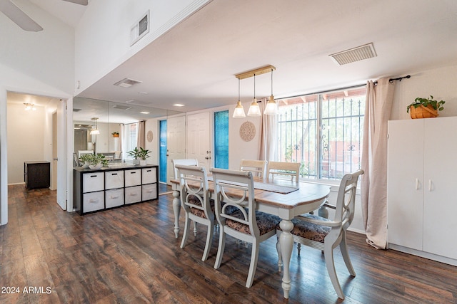 dining area featuring ceiling fan and dark hardwood / wood-style flooring