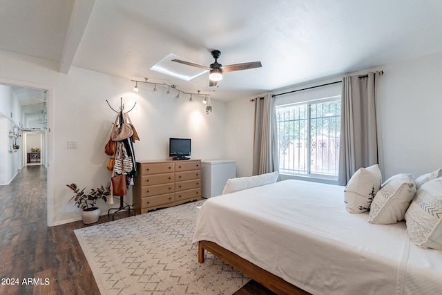 bedroom with ceiling fan, hardwood / wood-style floors, and rail lighting