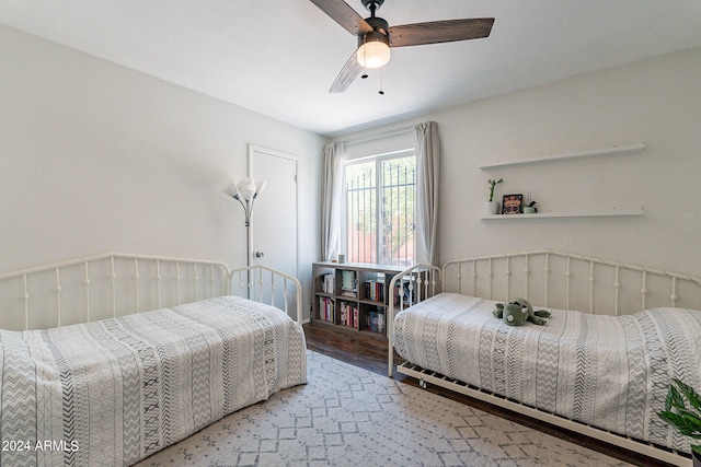 bedroom featuring ceiling fan and hardwood / wood-style flooring