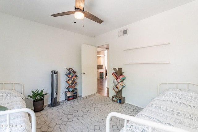 bedroom featuring hardwood / wood-style flooring and ceiling fan