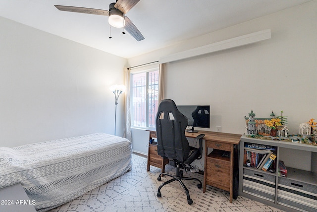 bedroom featuring ceiling fan and light carpet