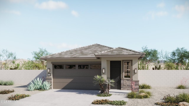 5649 N 205th Ln, Buckeye, AZ 85396 - prairie-style house featuring concrete driveway, an attached garage, and stucco siding
