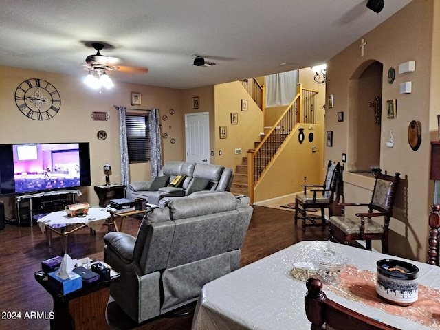 living room featuring ceiling fan, a textured ceiling, and hardwood / wood-style flooring