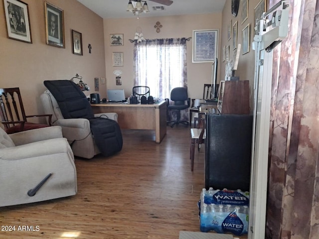 living room with ceiling fan and hardwood / wood-style floors