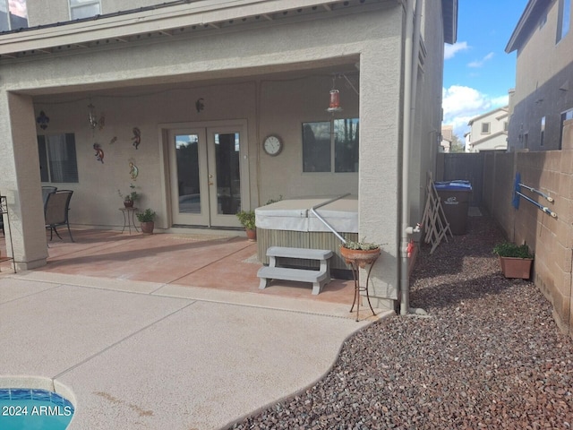 back of house with a patio and french doors