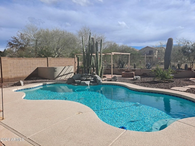 view of swimming pool featuring a patio area