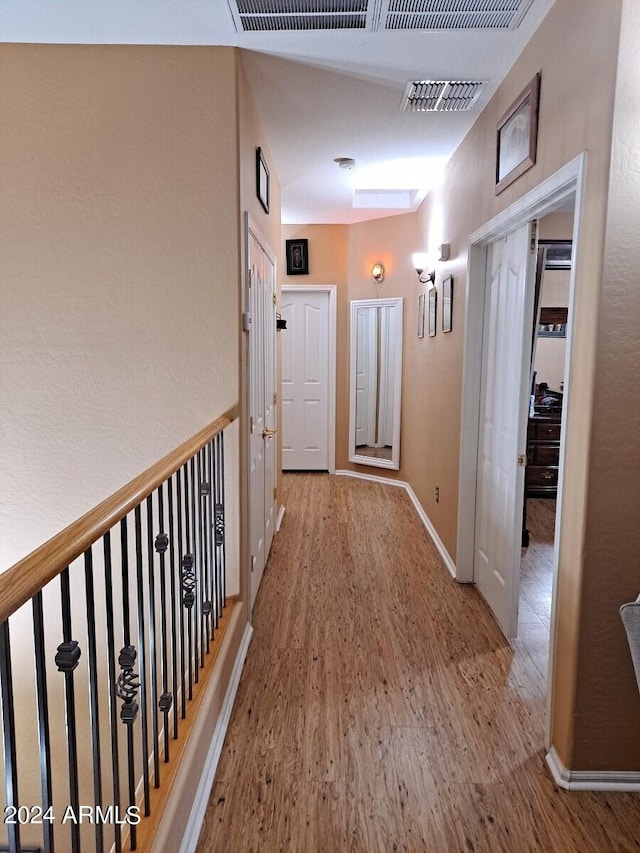 corridor featuring light hardwood / wood-style flooring