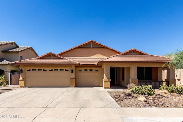 3028 W Parkside Ln, Phoenix, AZ 85027 - ranch-style house with an attached garage, driveway, stucco siding, and a tile roof