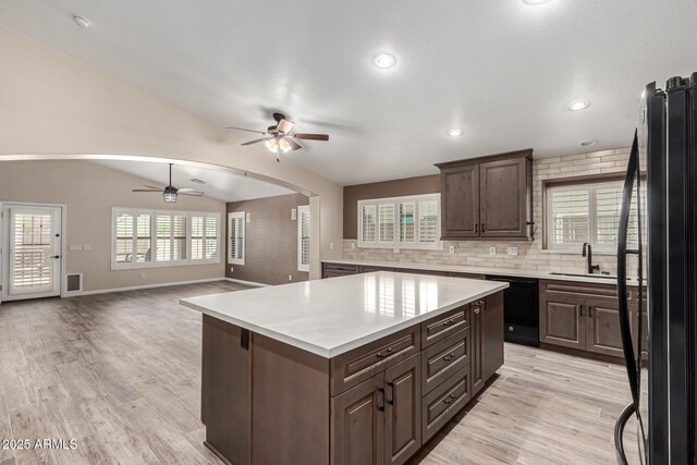 3028 W Parkside Ln, Phoenix, AZ 85027 - kitchen with ceiling fan, black appliances, light countertops, a sink, and light wood-style flooring