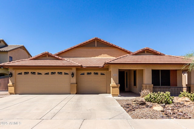 3028 W Parkside Ln, Phoenix, AZ 85027 - ranch-style house featuring a garage, concrete driveway, stucco siding, and a tile roof