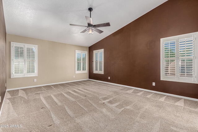 3028 W Parkside Ln, Phoenix, AZ 85027 - empty room with lofted ceiling, ceiling fan, baseboards, carpet flooring, and a textured ceiling