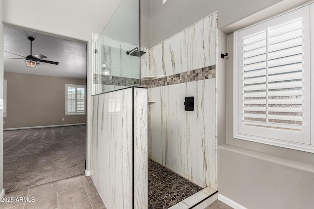 3028 W Parkside Ln, Phoenix, AZ 85027 - bathroom with a marble finish shower, a ceiling fan, tile patterned floors, and baseboards