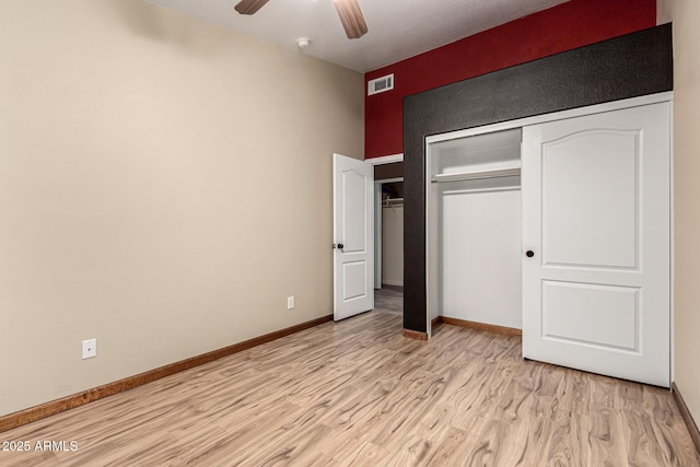 3028 W Parkside Ln, Phoenix, AZ 85027 - unfurnished bedroom featuring light wood-type flooring, baseboards, a closet, and ceiling fan