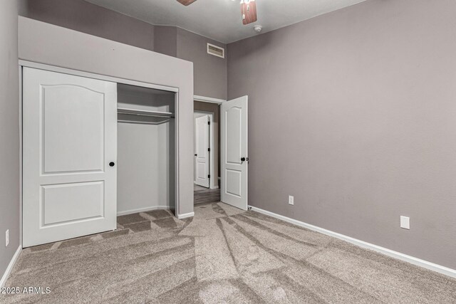 3028 W Parkside Ln, Phoenix, AZ 85027 - unfurnished bedroom featuring carpet flooring, a closet, baseboards, and ceiling fan