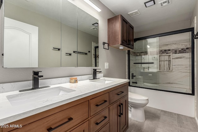 3028 W Parkside Ln, Phoenix, AZ 85027 - full bathroom with toilet, bath / shower combo with glass door, and double vanity