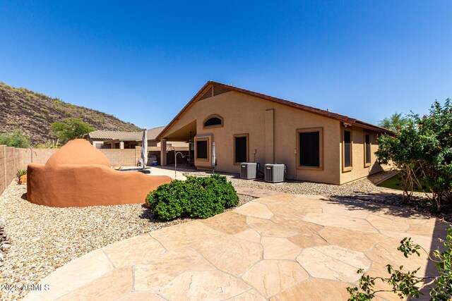 3028 W Parkside Ln, Phoenix, AZ 85027 - back of property with cooling unit, stucco siding, a fenced backyard, and a patio