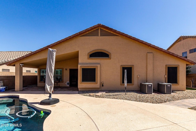 3028 W Parkside Ln, Phoenix, AZ 85027 - back of property with a patio, stucco siding, fence, and central AC