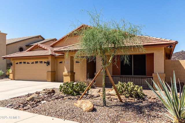 3028 W Parkside Ln, Phoenix, AZ 85027 - view of front of property featuring an attached garage, stucco siding, driveway, and a porch