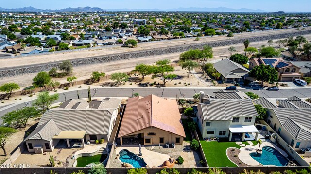 3028 W Parkside Ln, Phoenix, AZ 85027 - aerial perspective of suburban area featuring a pool area and mountains
